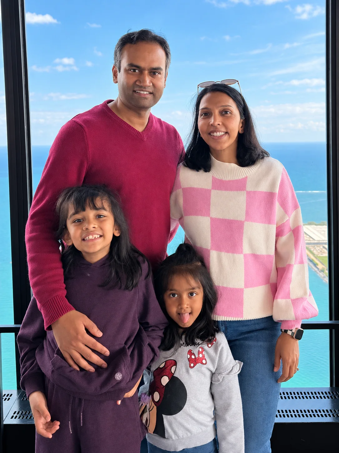 Dr. Dinesh Edem traveling with his wife and their two children